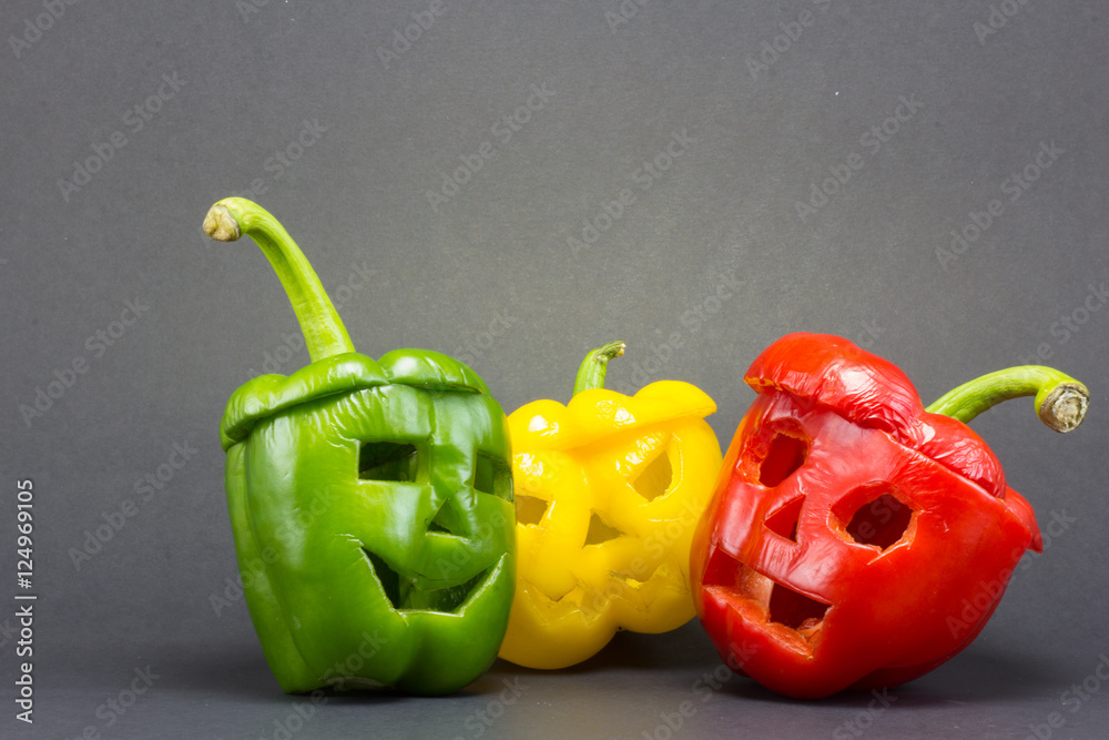 scary faces carved on bell peppers on a dark background for hall scary faces carved on bell peppers on a dark background for hall