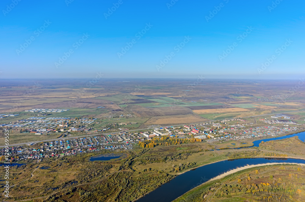 Aerial view onto Esaulovo village and Tura river during the autumn. Tyumen region