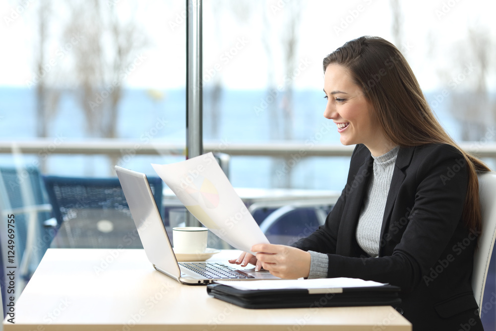 Businesswoman working in a coffee shop Businesswoman working in a coffee shop