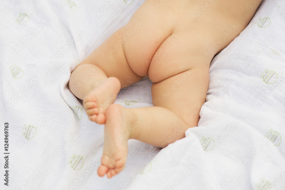 Naked baby's bottom and feet Naked baby's bottom and feet