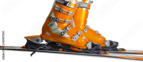 Fotografie Alpine ski boots in ski binding closeup