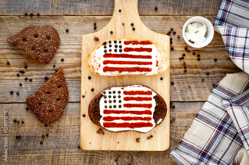 Two homemade sandwiches with image of american flag.
