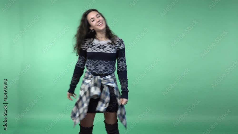 Young brunette woman having fun, pointing the finger, chroma key green screen background Young brunette woman having fun, pointing the finger, chroma key green screen background