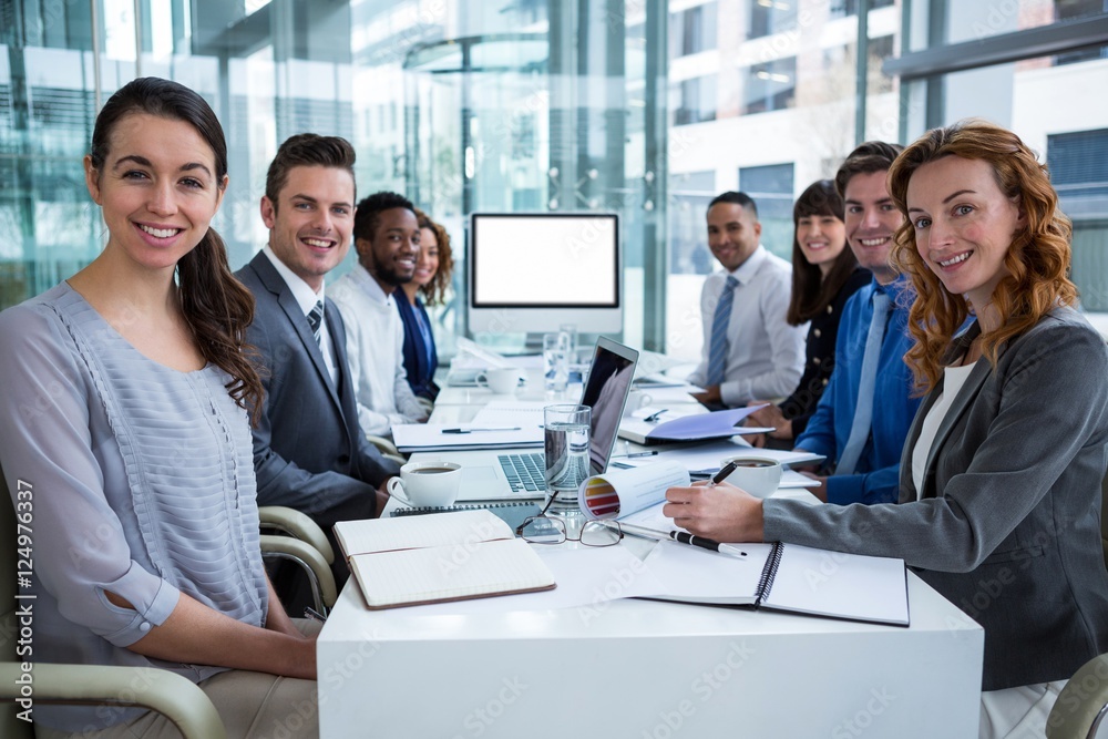 Business people looking at a screen during a video conference