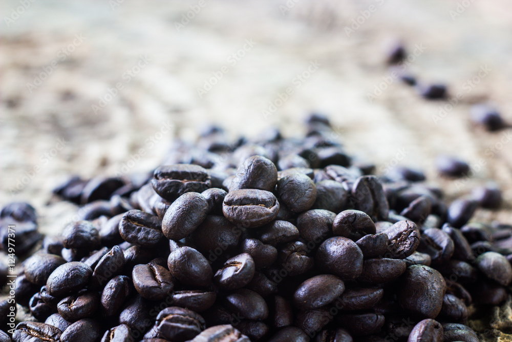 coffee beans on old teak coffee beans on old teak