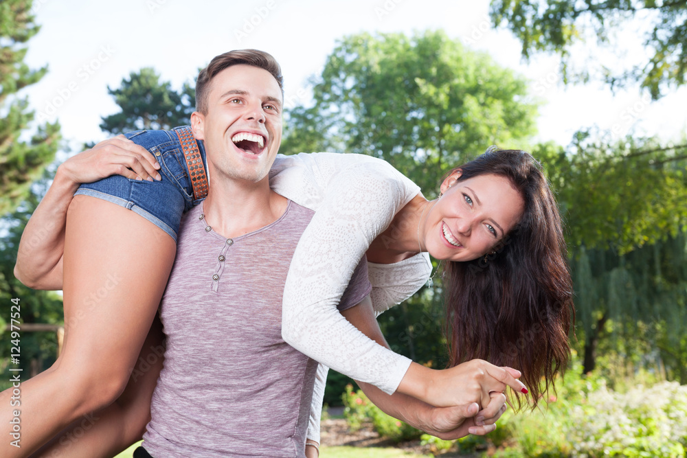 happy couple having fun in park happy couple having fun in park