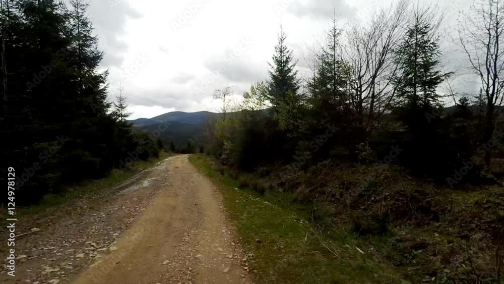 Car driving through the countryside in the mountains. The camera is outside. Car driving through the countryside in the mountains. The camera is outside.