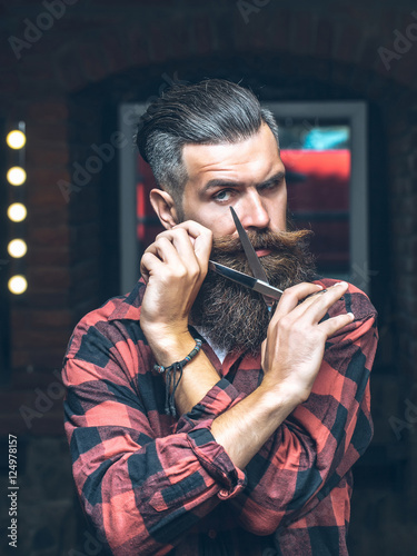 bearded man with scissors