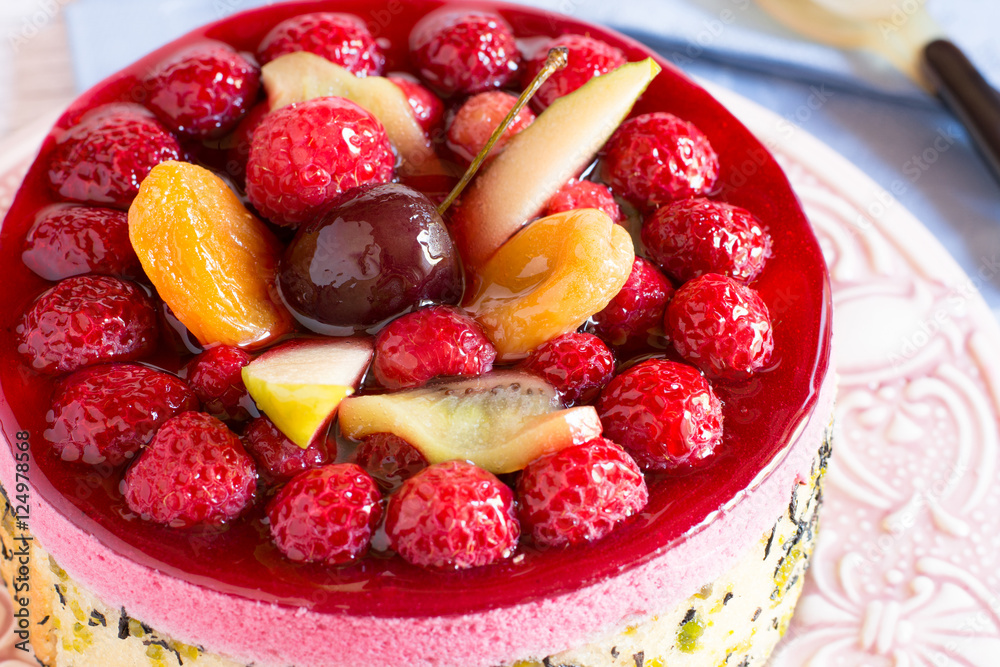 Close-up of jellied fruit and berries over delicious cake Close-up of jellied fruit and berries over delicious cake