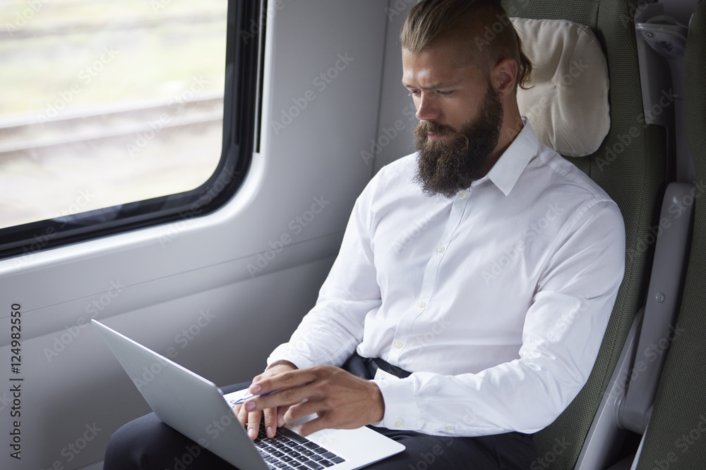 Modern businessman working in the train Modern businessman working in the train