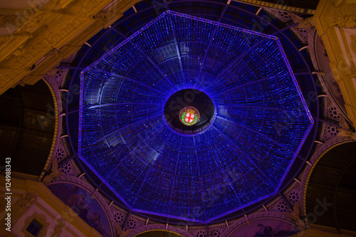 MILAN, ITALY - Dicember 24, 2015 -  Galleria Vittorio Emanuele II in Milan on Dicember 24 2015. Glass skylight dome at arcade Galleria Vittorio Emanuele II in Milan, Italy. photo