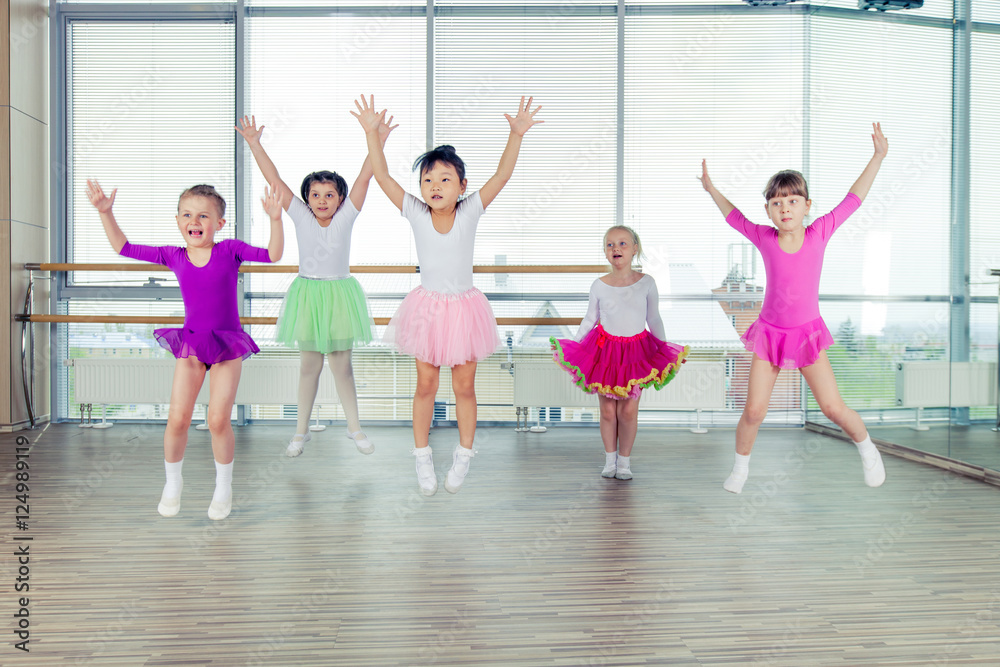 Fototapeta premium happy children dancing on in hall, healthy life, kid's togethern