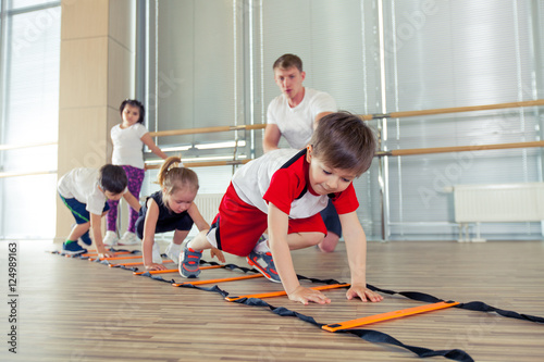 Happy sporty children in gym.