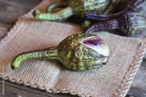 Raw ripe aubergine or Brinjal on napkin