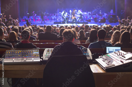 Obraz na płótnie Soundman working on the mixing console.
