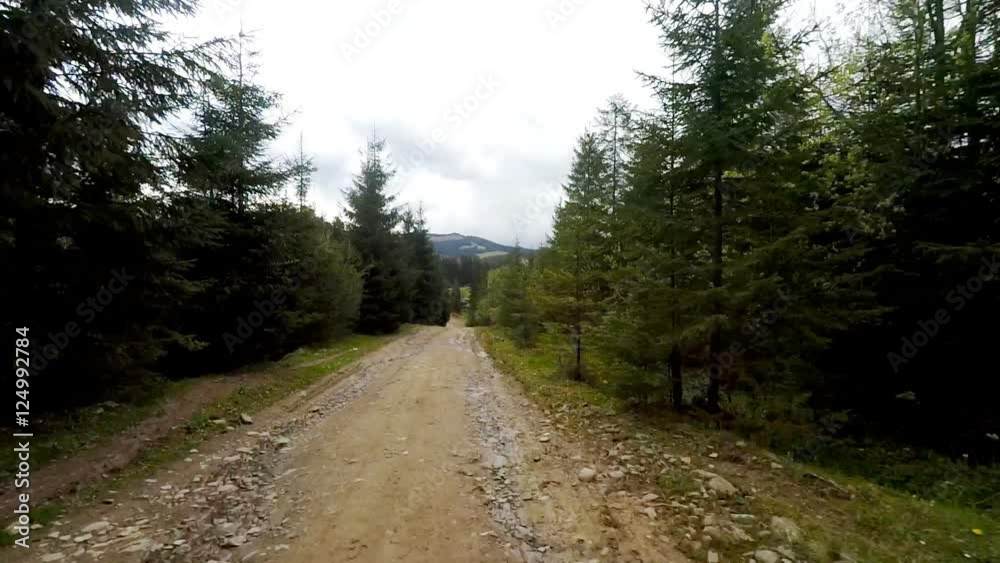 Car driving through the countryside in the mountains. The camera is outside. Car driving through the countryside in the mountains. The camera is outside.