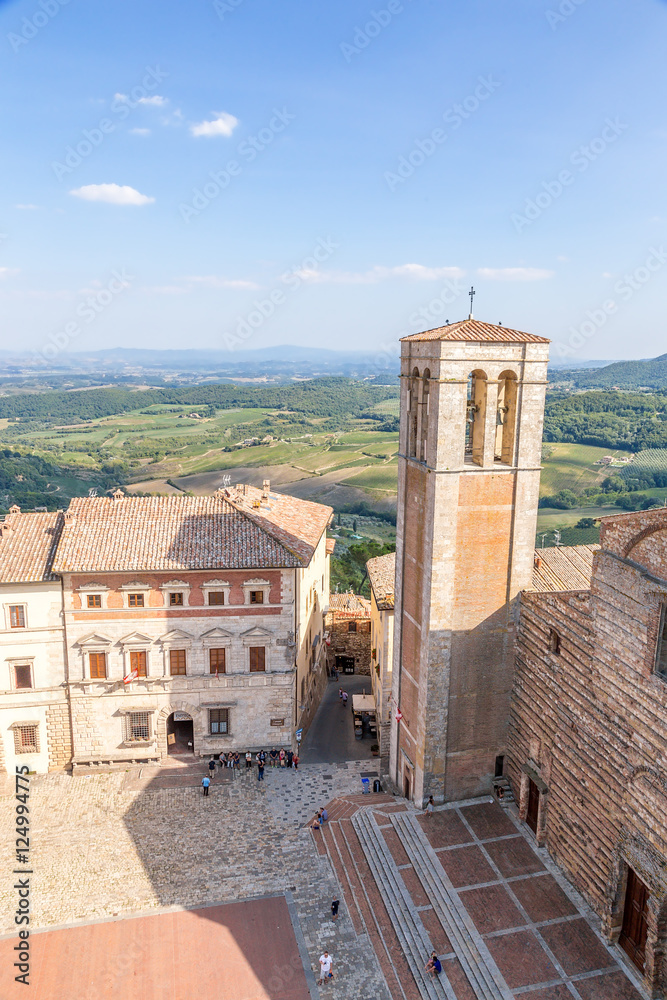 Montepulciano, Italy. Large Square: in the center - Contucci Palace, on the right - the bell tower (XV c.) and the Cathedral of the Assumption the Virgin Mary, 1592 - 1630