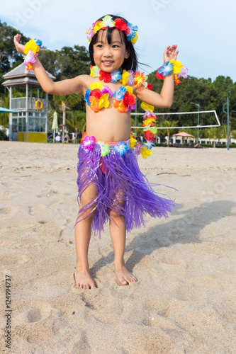 Asian Chinese little girl in hawaiian costume