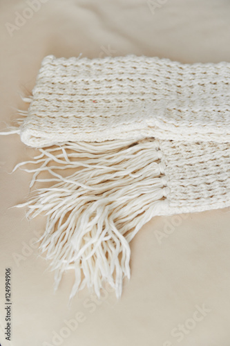 warm White knit scarf with tassels. Close