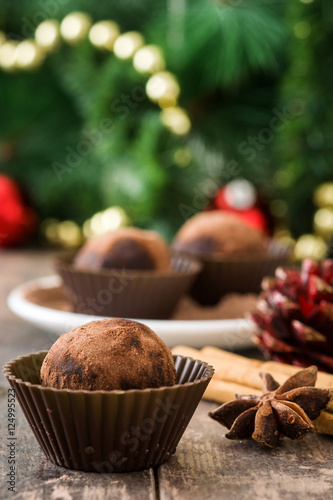 Christmas chocolate truffles on wooden table