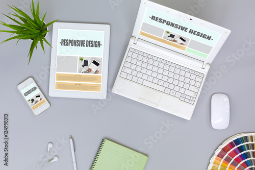 Working Place of web Designer on grey Table top View