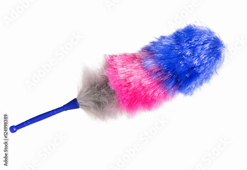 Broom for cleaning or soft colorful duster with plastic handle, isolated on white background