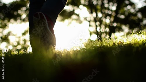 A man walking into the sun