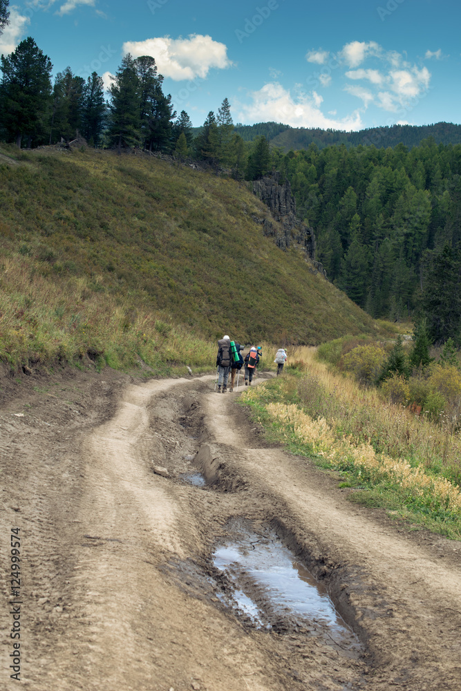 Tourists on the road in the Altai mountains, Russia