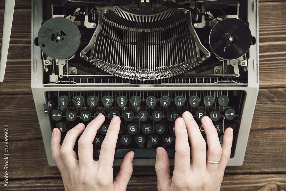 Writer typing with retro writing machine. View from above. - obrazy, fototapety, plakaty 