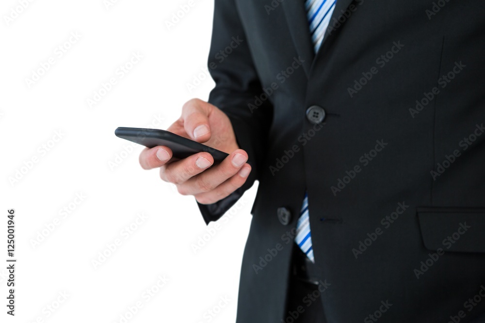 Mid section of businessman text messaging on mobile phone Mid section of businessman text messaging on mobile phone