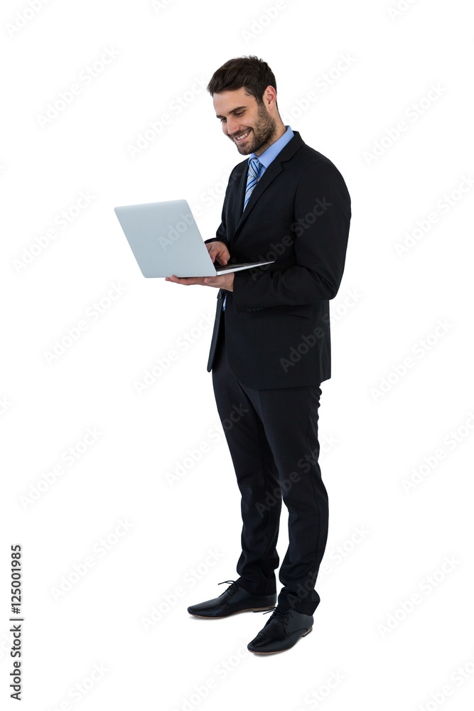 Businessman using laptop at his desk Businessman using laptop at his desk