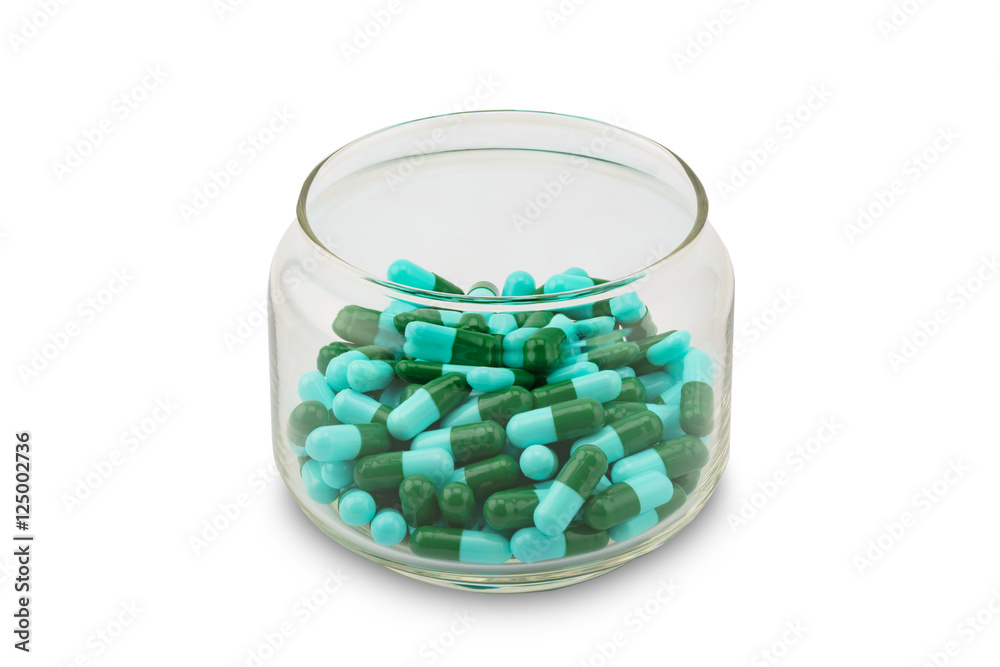 Blue and green capsule of antibiotic in a bottle Blue and green capsule of antibiotic in a bottle