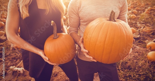 Couple at the pumpkin patch photo