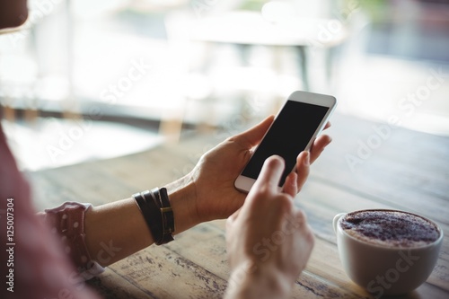 Woman using mobile phone photo