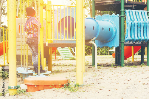 Child playing in the playground.Or boy playing is happy and funny with his activity.Experience of little boy.