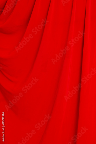 folds of red material as background photo