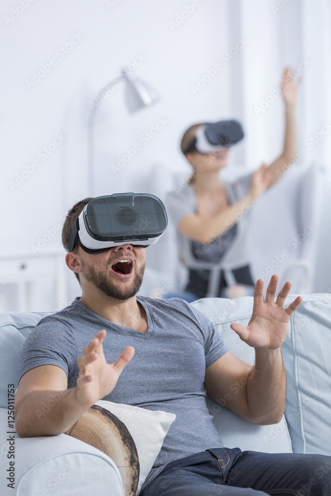 Excited man using 3D glasses