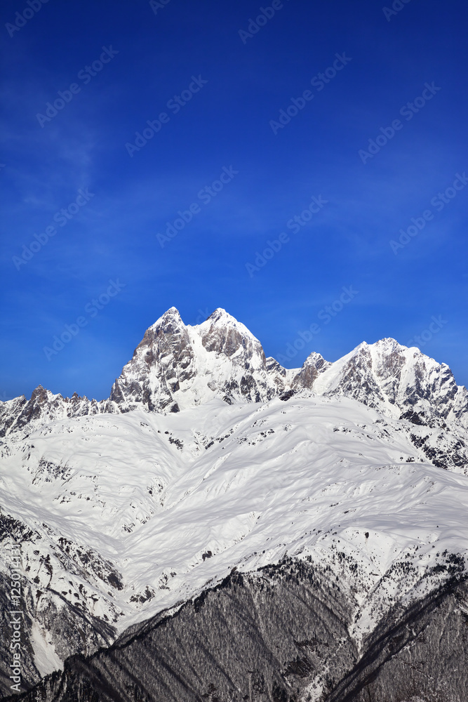Mount Ushba in winter at sun day