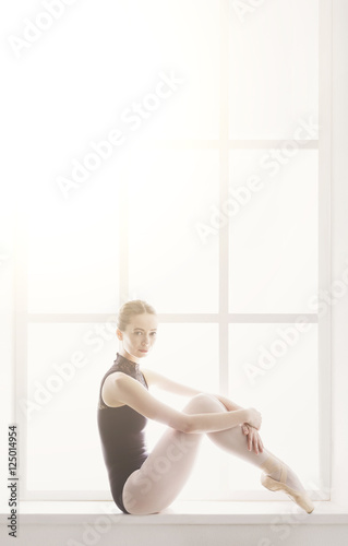 Classical Ballet dancer portrait at window background