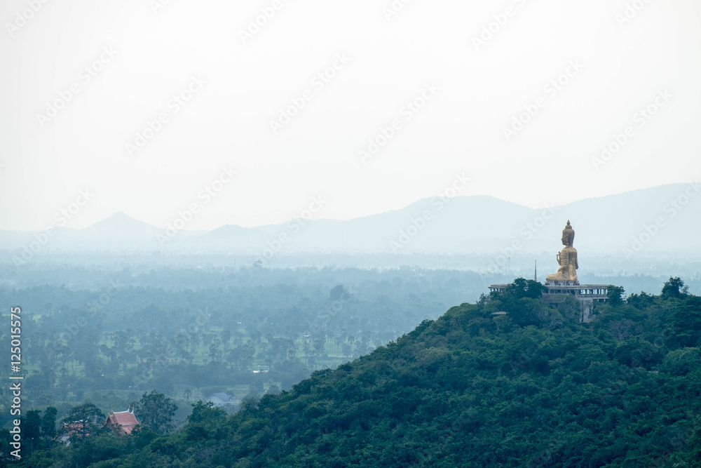 Giant Budda image on hill, face to Petchaburi town, Thailand. Mood and tone version. Giant Budda image on hill, face to Petchaburi town, Thailand. Mood and tone version.