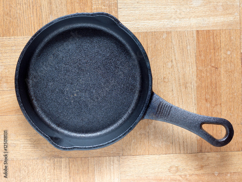Cast iron skillet on wooden table