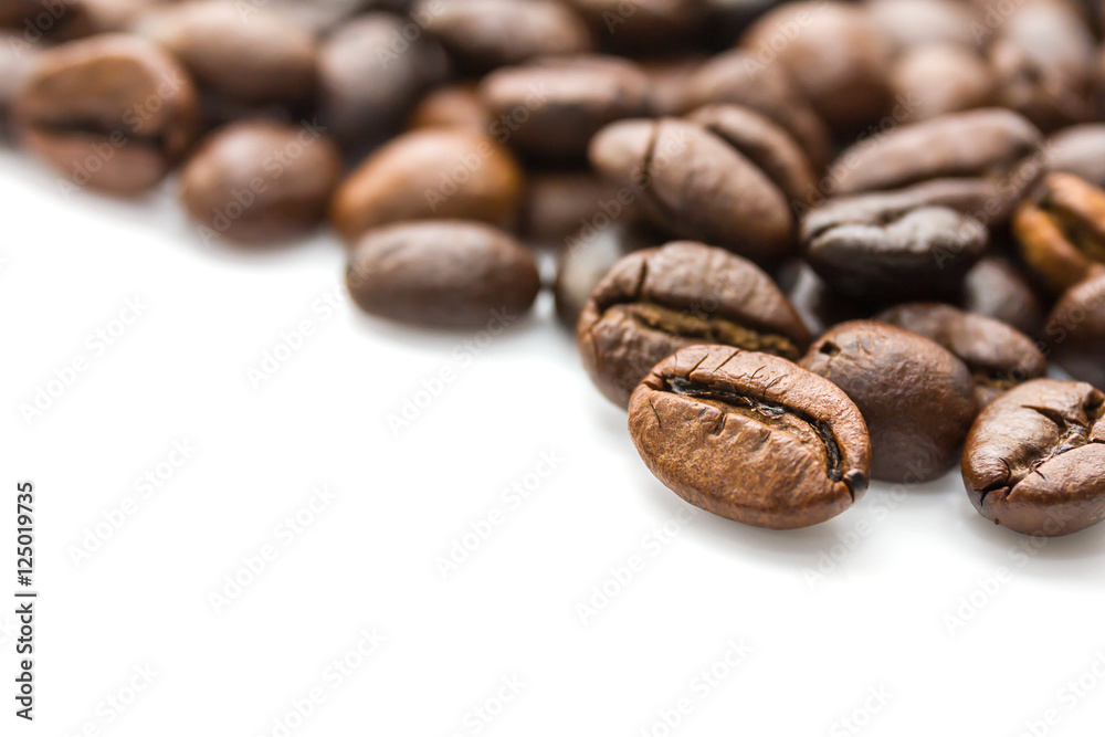 Roasted coffee beans on white Roasted coffee beans on white
