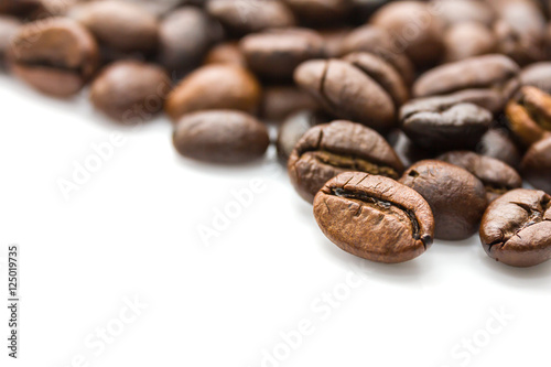  Roasted coffee beans on white