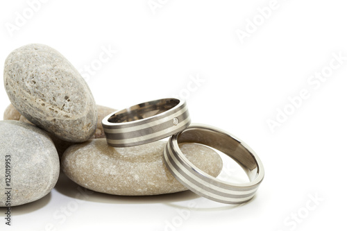 Wedding rings on pebbles isolated