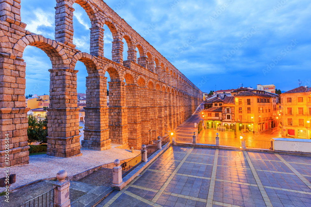 Segovia, Spain town view at Plaza del Azoguejo and the ancient Roman aqueduct.