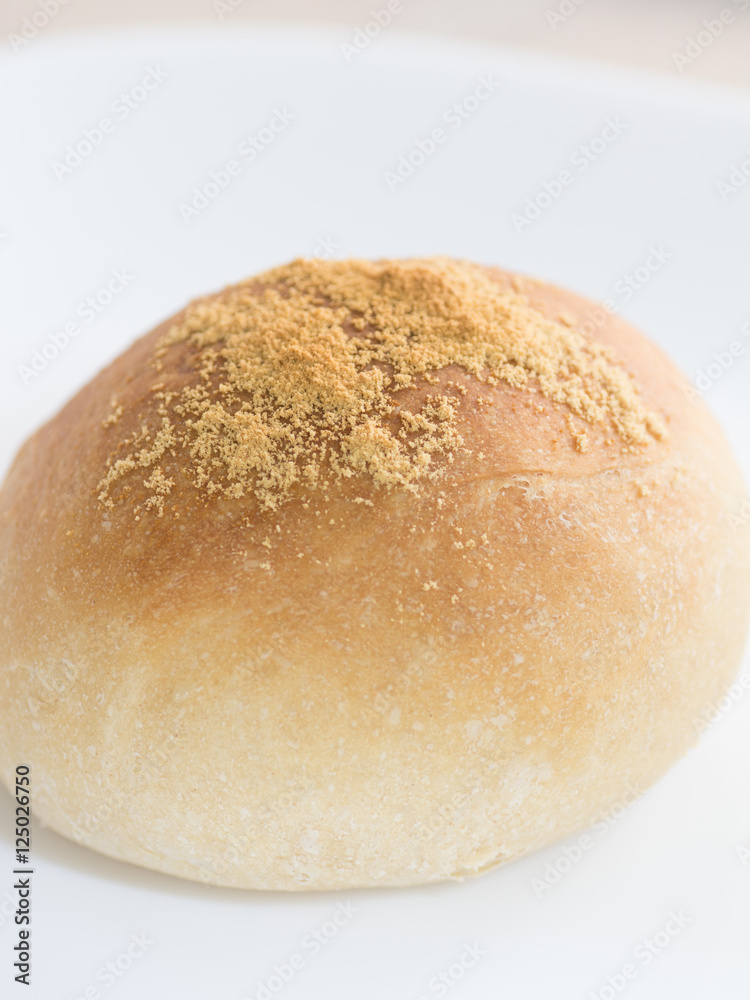 Homemade dinner roll on white isolated background Homemade dinner roll on white isolated background