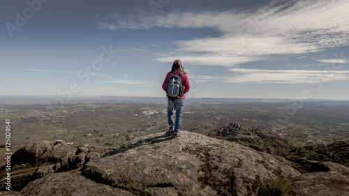 Girl standing on the top of a hill, Alentejo, Protugal photo