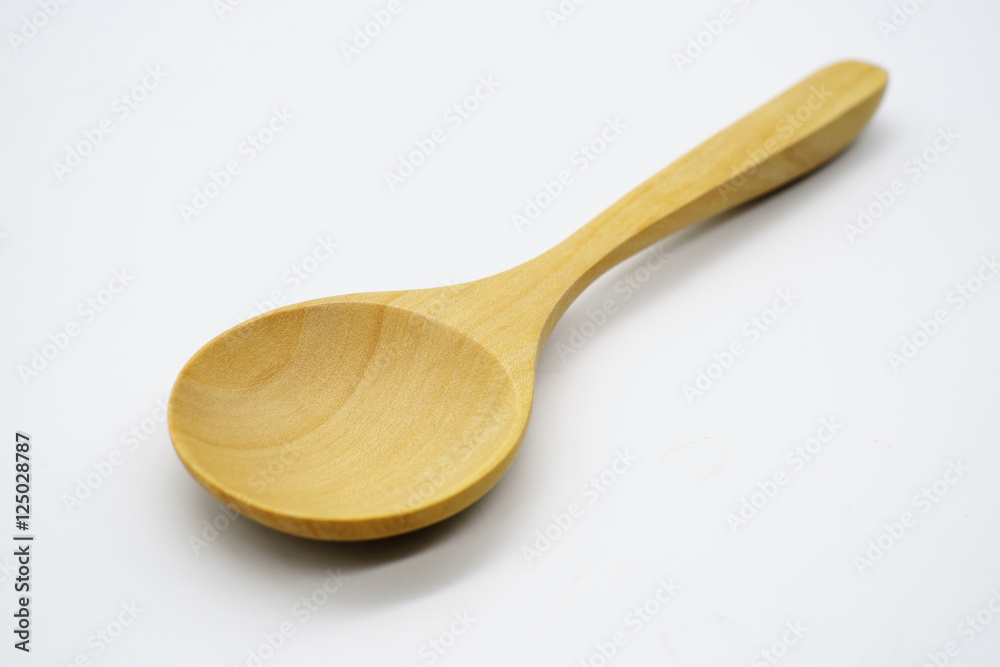 Close-up wooden spoon isolated on white background Close-up wooden spoon isolated on white background