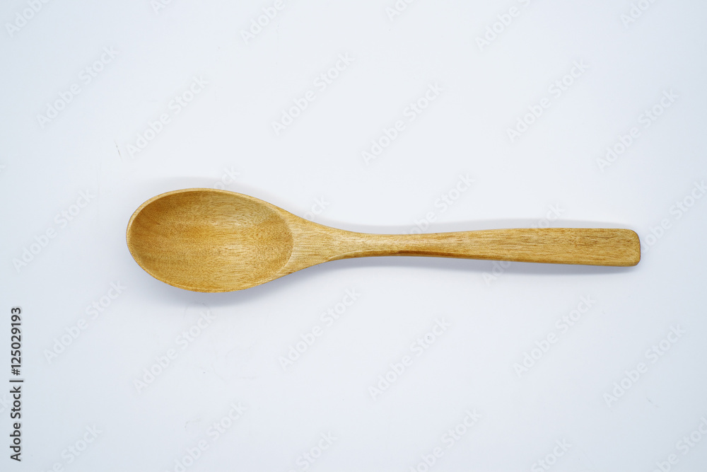Close-up wooden spoon isolated on white background Close-up wooden spoon isolated on white background