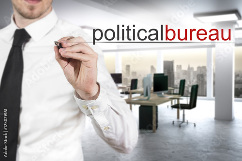 businessman writing political bureau in modern office photo
